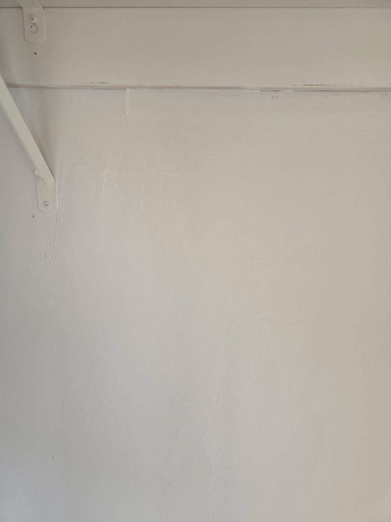 Professionally repaired and finished drywall completed by Blue Line Home Services. 