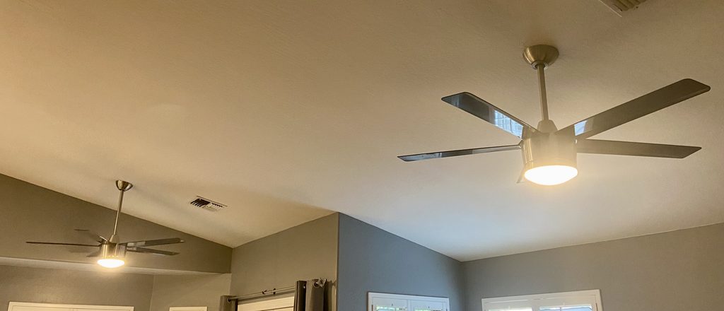 Two professionally installed ceiling fans completed by Blue Line Home Services. 